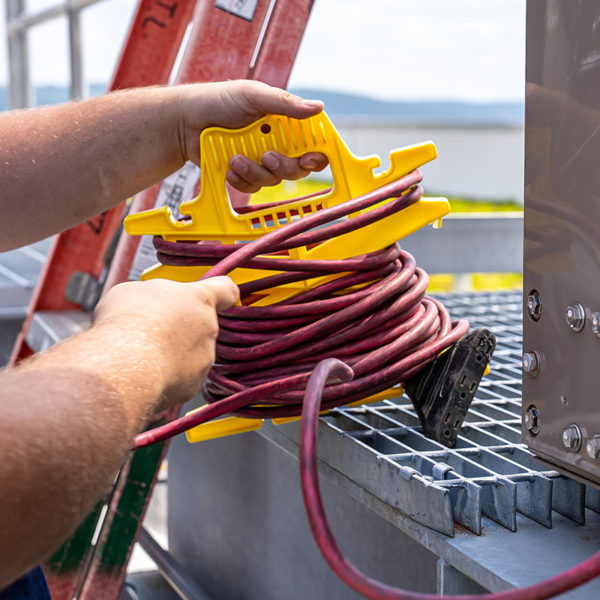 Stringliner CordWiz Extension Cord holder.